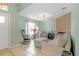 Comfortable living room features a tiled fireplace, light-filled window, and rocking chair at 1862 Shelby Ter, Deltona, FL 32725