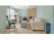 Inviting living room with tiled fireplace, light-filled window and comfortable seating arrangement at 1862 Shelby Ter, Deltona, FL 32725