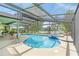 Screened-in pool and spa overlooking the lake is perfect for relaxing and entertaining at 1862 Shelby Ter, Deltona, FL 32725
