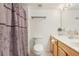 Bathroom featuring vanity, toilet, and shower with Paris-themed curtain at 193 Fish Hawk Dr, Winter Haven, FL 33884