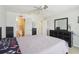 Bedroom featuring gray walls, carpet, and a view into the ensuite bathroom at 193 Fish Hawk Dr, Winter Haven, FL 33884