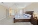 Expansive main bedroom with carpet, ceiling fan, and dresser at 193 Fish Hawk Dr, Winter Haven, FL 33884