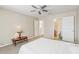 Bright bedroom featuring a ceiling fan, neutral carpet, and ensuite bathroom at 193 Fish Hawk Dr, Winter Haven, FL 33884