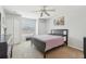 Well-lit bedroom featuring a large window, carpet flooring, and closet space at 193 Fish Hawk Dr, Winter Haven, FL 33884
