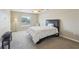 Spacious carpeted bedroom with a large window and seating area at 193 Fish Hawk Dr, Winter Haven, FL 33884
