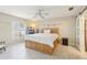 Bright bedroom with a ceiling fan, wooden bed frame and light wood flooring at 193 Fish Hawk Dr, Winter Haven, FL 33884