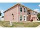 The home features a three-car garage, arched windows, and mature landscaping, offering both convenience and curb appeal at 193 Fish Hawk Dr, Winter Haven, FL 33884