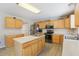 Charming kitchen with ample cabinet space, stainless steel appliances, and functional center island at 193 Fish Hawk Dr, Winter Haven, FL 33884