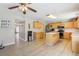 Well-lit kitchen boasts stainless steel appliances, light wood cabinetry, and an efficient island at 193 Fish Hawk Dr, Winter Haven, FL 33884