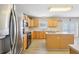 Cozy kitchen with stainless appliances and pool view from the window, a delightful culinary space at 193 Fish Hawk Dr, Winter Haven, FL 33884