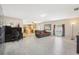 Open-concept living area showcasing views of the kitchen and the pool area, with stylish floors at 193 Fish Hawk Dr, Winter Haven, FL 33884
