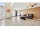 The spacious living room boasts high ceilings, laminate floors, and ample natural light, creating an inviting atmosphere at 193 Fish Hawk Dr, Winter Haven, FL 33884