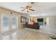 Inviting living room with pool views through French doors, offering seamless indoor-outdoor living at 193 Fish Hawk Dr, Winter Haven, FL 33884
