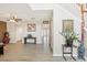 Bright living room featuring wood-look floors and staircase, leading to the home's upper level at 193 Fish Hawk Dr, Winter Haven, FL 33884