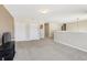 Spacious loft area with carpet flooring, double door closets, and television at 193 Fish Hawk Dr, Winter Haven, FL 33884