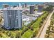 Aerial view of a white high-rise condo with balconies near a golf course, offering luxurious living and beautiful surroundings at 2 Oceans West Blvd # 1007, Daytona Beach, FL 32118