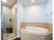 Spacious bathroom with shower and large soaking tub at 2 Oceans West Blvd # 1007, Daytona Beach, FL 32118