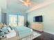 Airy bedroom featuring balcony access, light wood furniture, and gorgeous ocean views at 2 Oceans West Blvd # 1007, Daytona Beach, FL 32118