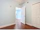 Bedroom featuring hardwood floors, neutral wall color, and a standard closet at 2 Oceans West Blvd # 1007, Daytona Beach, FL 32118