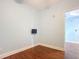 Bedroom featuring hardwood floors, neutral wall color, and walk-in closet at 2 Oceans West Blvd # 1007, Daytona Beach, FL 32118