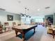 Relaxing billiard room with a pool table, a library and comfortable seating for leisurely enjoyment at 2 Oceans West Blvd # 1007, Daytona Beach, FL 32118