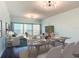 Bright, open dining space featuring a marble-top table, seating for six, and ocean views at 2 Oceans West Blvd # 1007, Daytona Beach, FL 32118