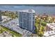 Exterior showcases a high-rise condo building with bay views and meticulously landscaped surroundings at 2 Oceans West Blvd # 1007, Daytona Beach, FL 32118