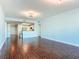 Open floor plan featuring hardwood floors and modern lighting with easy access to the kitchen at 2 Oceans West Blvd # 1007, Daytona Beach, FL 32118