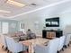 Clubhouse lounge with seating arranged around a large TV, elegant decor and a peaceful ambiance at 2 Oceans West Blvd # 1007, Daytona Beach, FL 32118