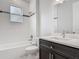 Bathroom with subway tile, shower-tub combo, modern vanity, and stylish fixtures at 200 S Montgomery Ave, Deland, FL 32720