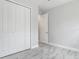 Bedroom with closet, open entry, and stylish marble-look tile floors at 200 S Montgomery Ave, Deland, FL 32720