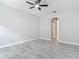 Empty bedroom with modern ceiling fan, tiled floor and neutral color palette at 200 S Montgomery Ave, Deland, FL 32720