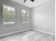 Bedroom with two windows providing natural light and tile floors at 200 S Montgomery Ave, Deland, FL 32720