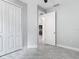 Bedroom with closet and open entry offers tile floors and neutral paint at 200 S Montgomery Ave, Deland, FL 32720