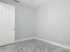 Bedroom with light gray paint, white trim, and marble-look tile floors at 200 S Montgomery Ave, Deland, FL 32720