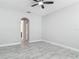 Spacious bedroom showcasing gray tile floors and a view of the ensuite bathroom at 200 S Montgomery Ave, Deland, FL 32720