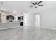 Open concept living room showing access to kitchen, dining, and outdoor spaces at 200 S Montgomery Ave, Deland, FL 32720