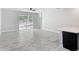 Open living area with tile floors, sliding doors to backyard, and modern finishes at 200 S Montgomery Ave, Deland, FL 32720