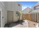 Small backyard featuring a door, gate, and air conditioning unit at 207 Pine Cone Trl, Ormond Beach, FL 32174