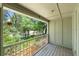 A screened-in balcony with views of lush greenery at 207 Pine Cone Trl, Ormond Beach, FL 32174