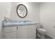 Neat bathroom featuring a vanity with sink and toilet at 207 Pine Cone Trl, Ormond Beach, FL 32174
