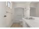 Bathroom with a shower, white single sink vanity, and neutral flooring at 207 Pine Cone Trl, Ormond Beach, FL 32174