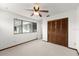Bedroom featuring a window with lots of natural light and a closet with wood doors at 207 Pine Cone Trl, Ormond Beach, FL 32174