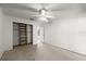 Bedroom featuring neutral carpet and a reach-in closet with built in shelves at 207 Pine Cone Trl, Ormond Beach, FL 32174