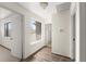 Bright hallway with hardwood floors and access to multiple rooms at 207 Pine Cone Trl, Ormond Beach, FL 32174