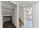 Hallway view to kitchen area and closet under the stairs at 207 Pine Cone Trl, Ormond Beach, FL 32174