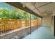Outdoor patio area with tiled flooring and view of fenced yard at 207 Pine Cone Trl, Ormond Beach, FL 32174