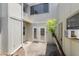 Private patio featuring double doors, and an air conditioning unit at 207 Pine Cone Trl, Ormond Beach, FL 32174