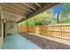 Relaxing outdoor patio overlooking a fenced backyard with lush landscaping at 207 Pine Cone Trl, Ormond Beach, FL 32174