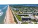 Sweeping aerial shot of Ormond Breakers Condo with ocean and neighborhood views at 2100 Ocean Shore Blvd # 1120, Ormond Beach, FL 32176
